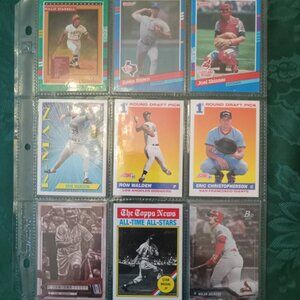 Nine assorted baseball cards in sleeve from the 90s in great condition